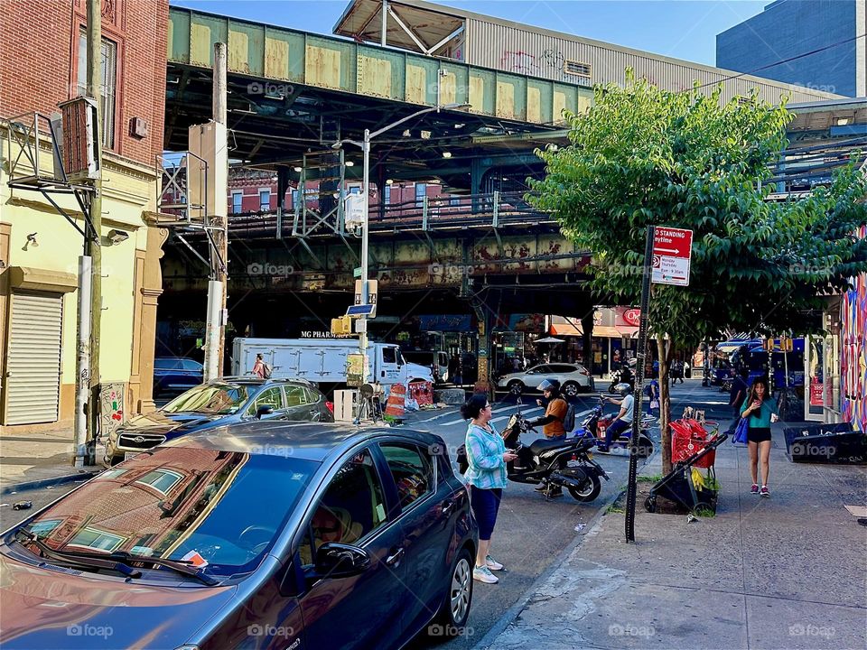 This is the “M” train overpass at “Jefferson St”, “Broadway” and “Myrtle Ave” at the “Myrtle Ave” “M” train station on a sunny late afternoon in September 2024. Hypnotic Productions