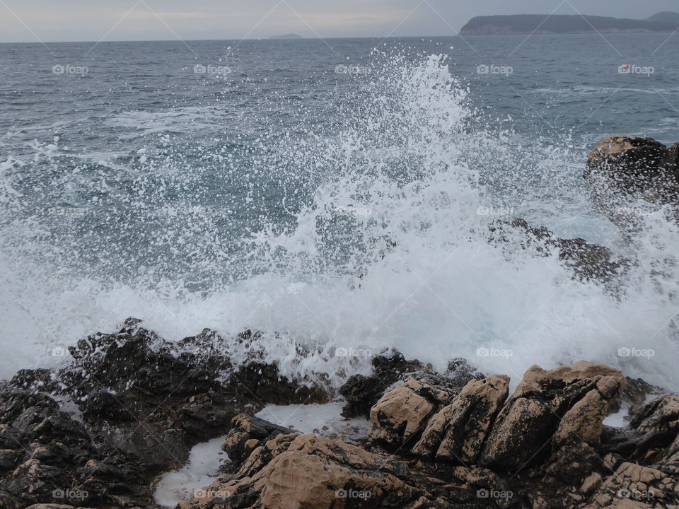waves crashing into the rocks