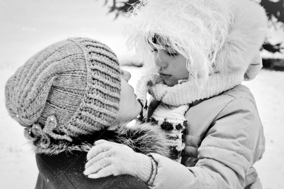 mom hugs her daughter