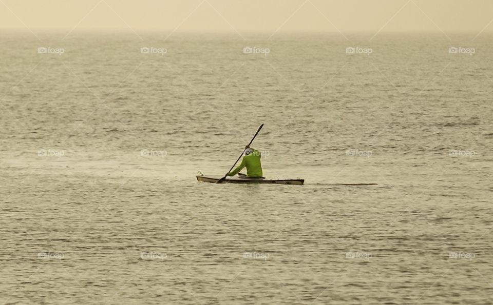 Human Interest.. Captured a Man while paddling his Kayak at the Coast of Coloane during Sunrise...