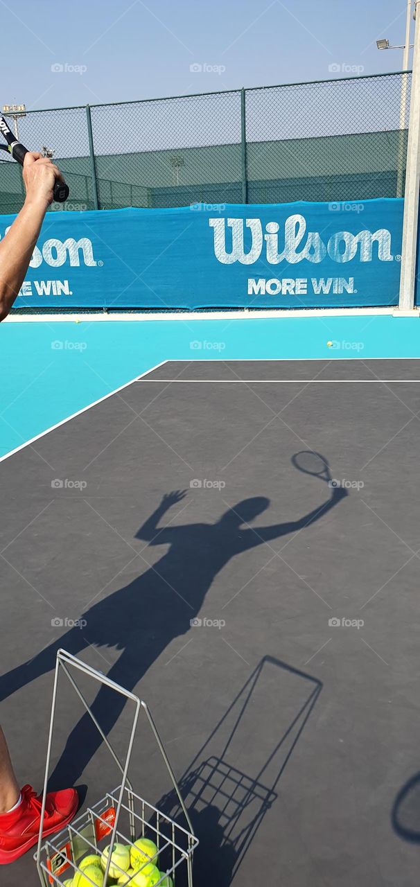 My shadow playing tennis....