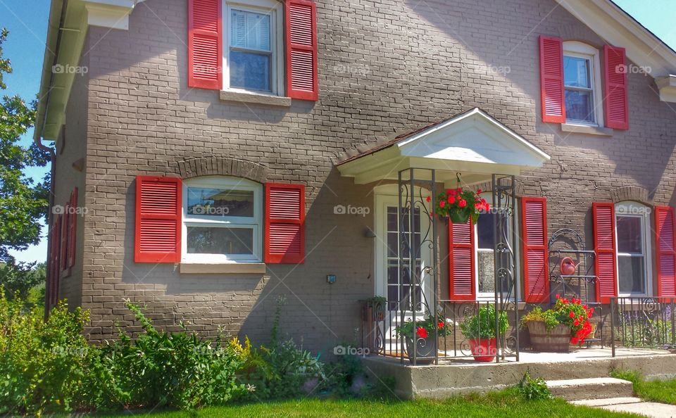 Brick House Red Shutters