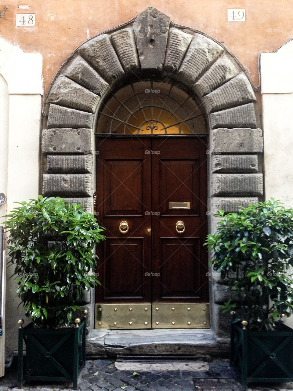 The entrance door with knock. Roma. Italy. 