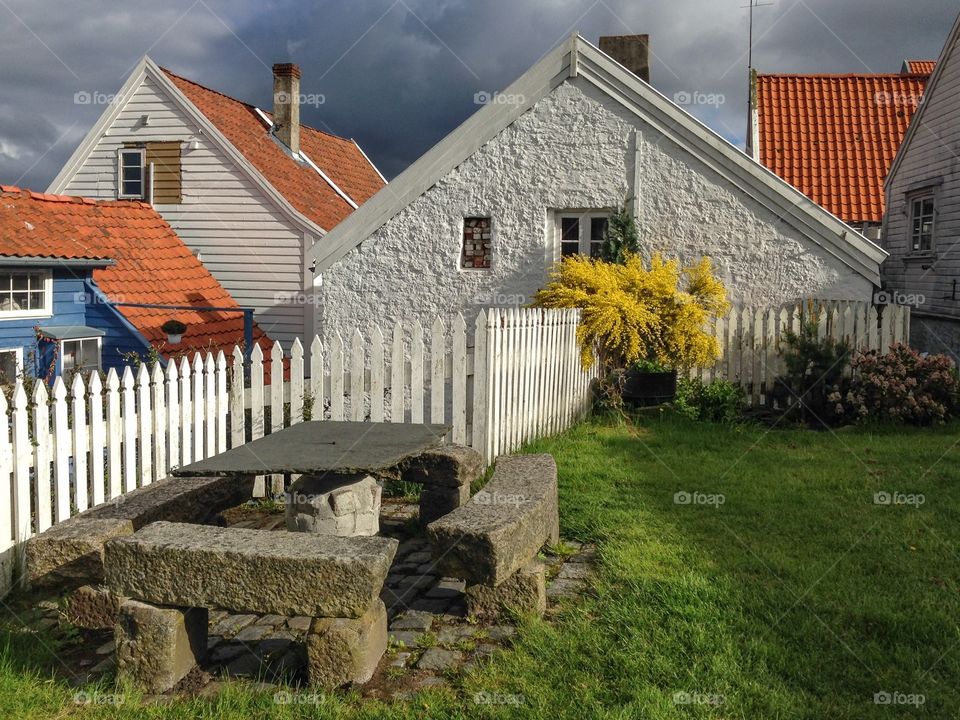 Old Stavanger, Norway. Little garden and old white and blue houses in the Old Town are of Stavanger, Norway 