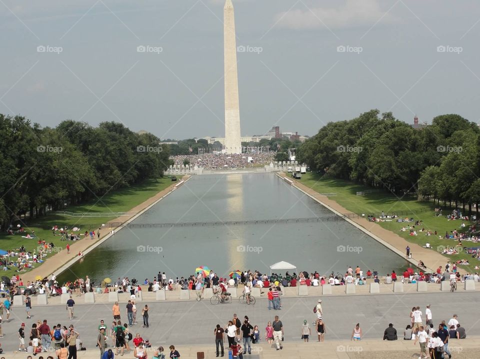 Washington monument . Fourth of July. People finding seats for fireworks display 