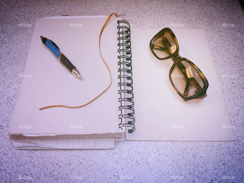 Diary and sunglasses
