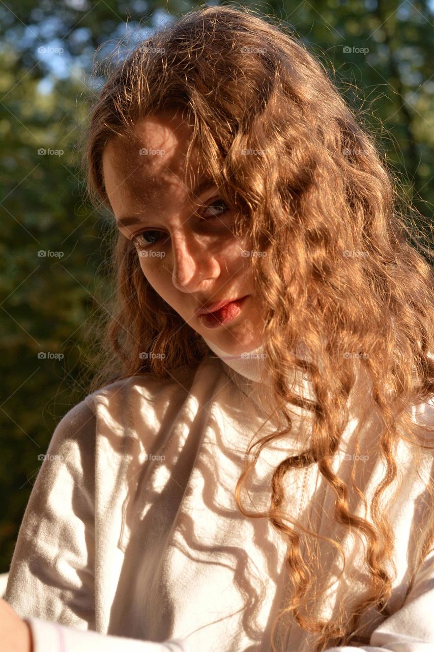 young girl beautiful portrait in sunlight and shadows