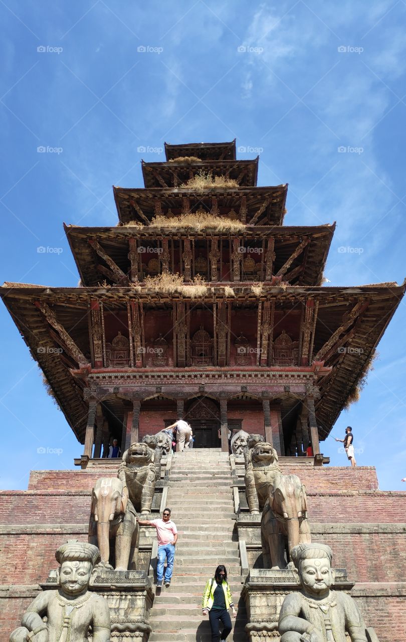 Beautiful architecture Handmade by the ancient Nepalese. Guarded/surrounded by some statue of elephants and lions.