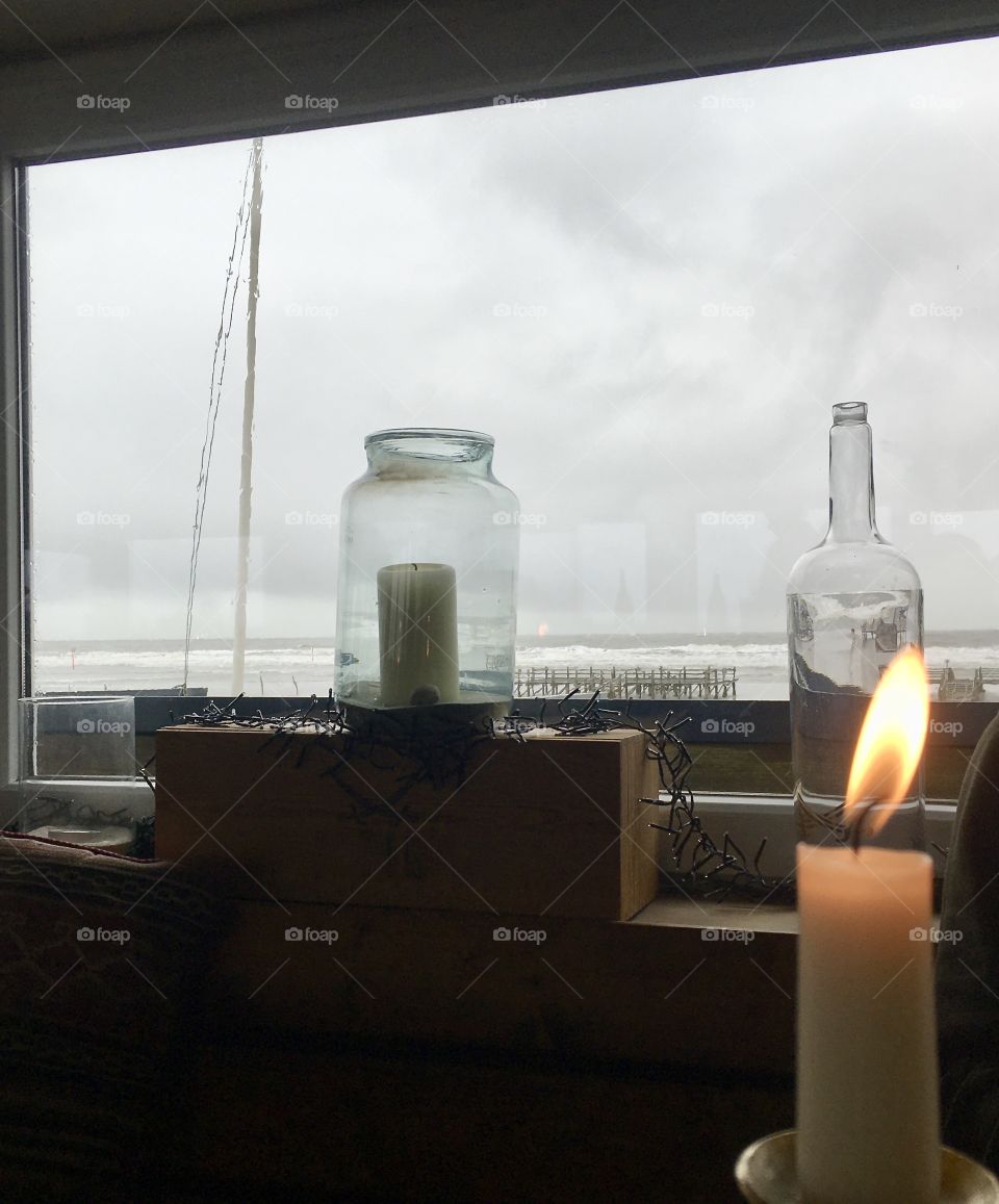 View of the sea from the window on a rainy day