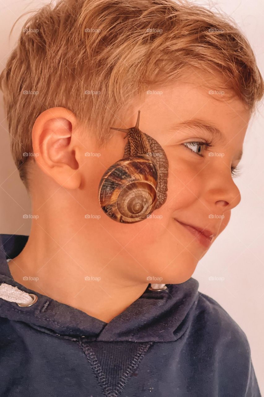 A boy with a Worm on his face