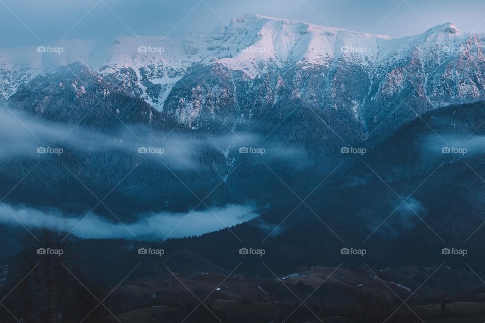 Amazing landscape with mountains in winter at blue hour, right after sunset time.