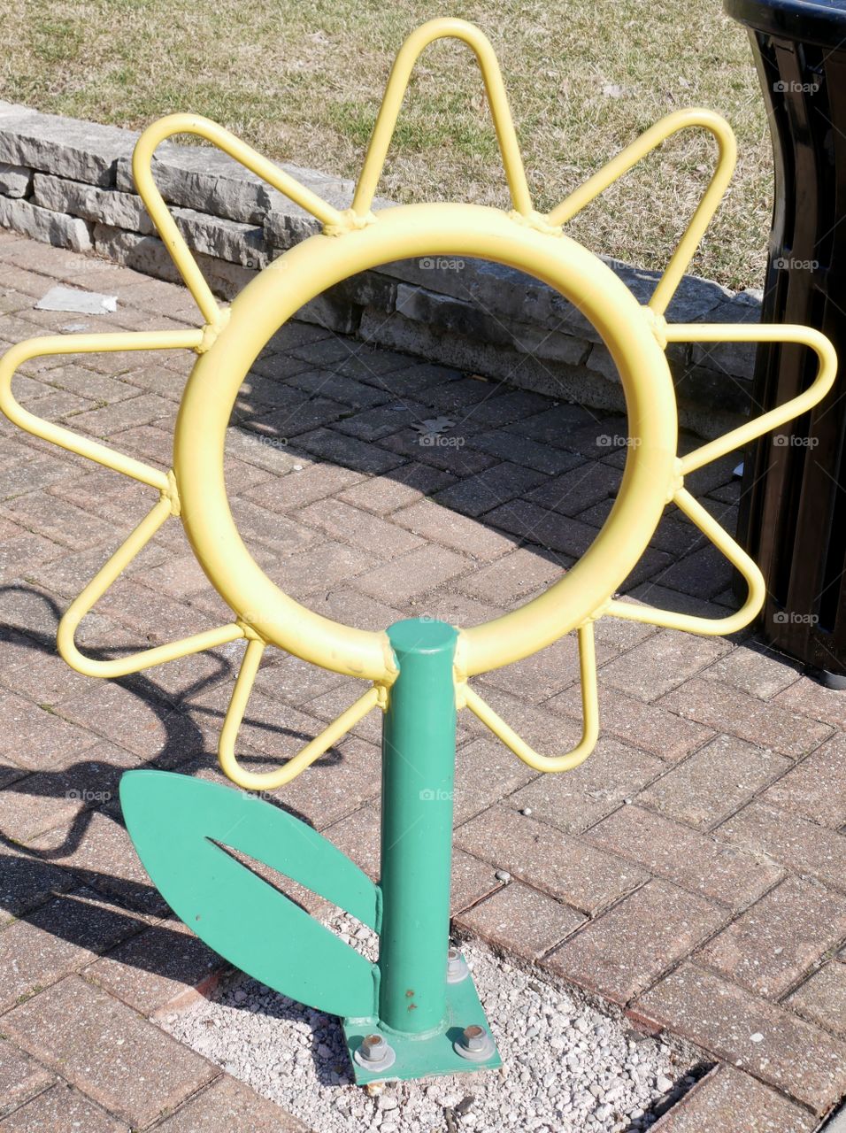 A fun metal sunflower, found on the sidewalk. Art in the city!