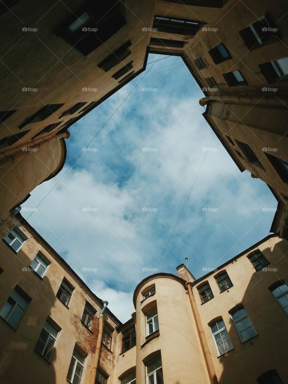 a view of the sky from one yard in saint petersburg