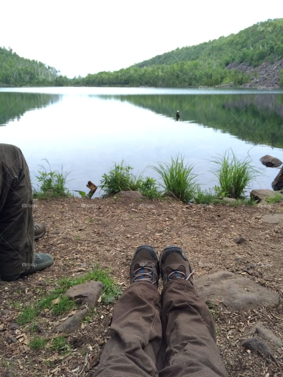 Camping and backpacking at a lake, camping feet exposed