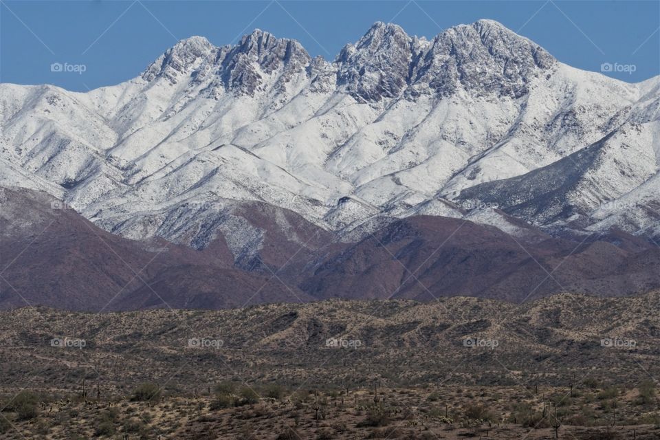 The Four Peaks mountain chain near Phoenix Arizona is covered in rare winter snow