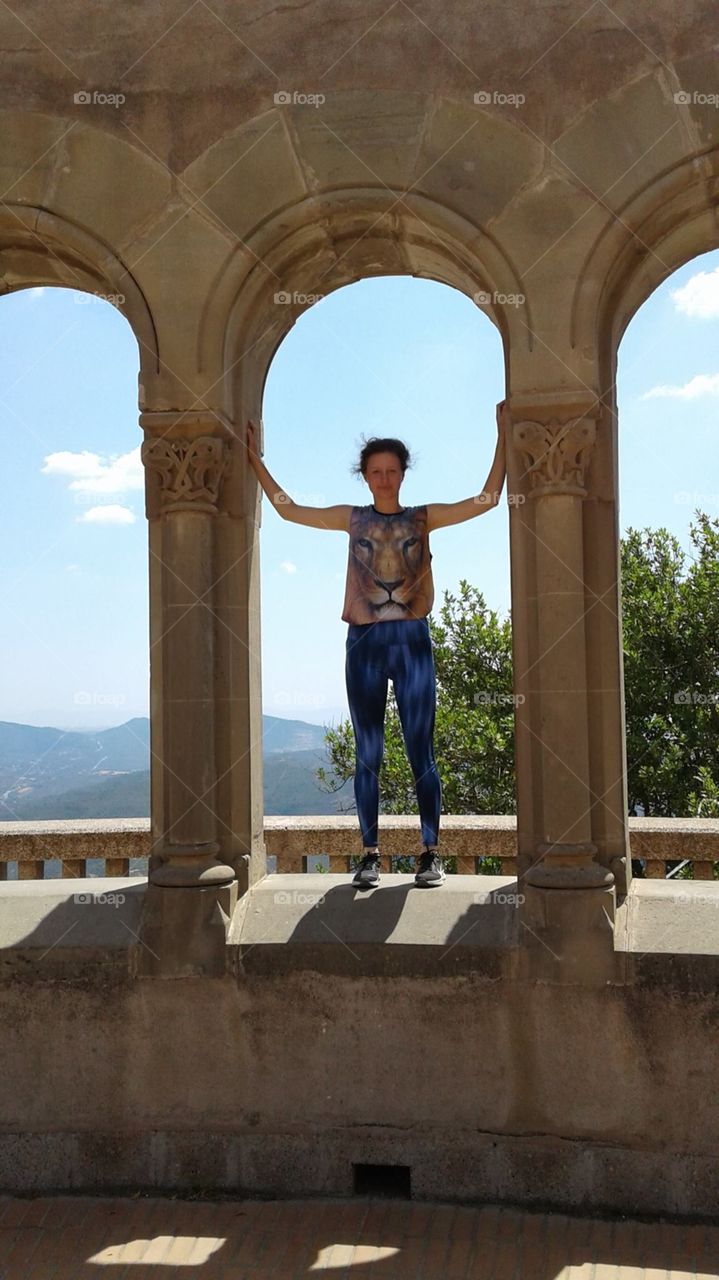 Young woman stands between arches of an ancient structure against the backdrop of beautiful countryside.
Montserrat Abbey in Catalonia.
(not the clearest photo, but I love it🙂)
