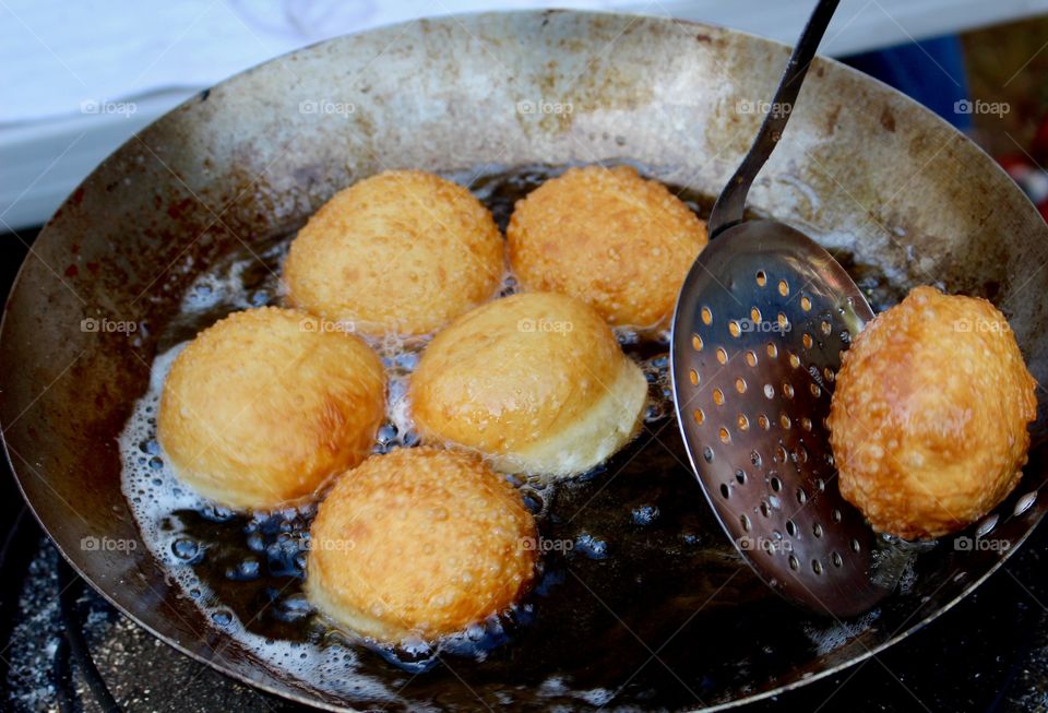 Cooking doughnuts, market.