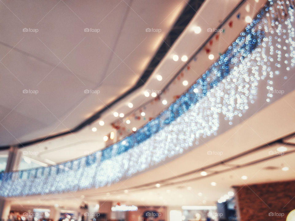 Blurred image background of lights decoration in department store for Christmas and New Year 