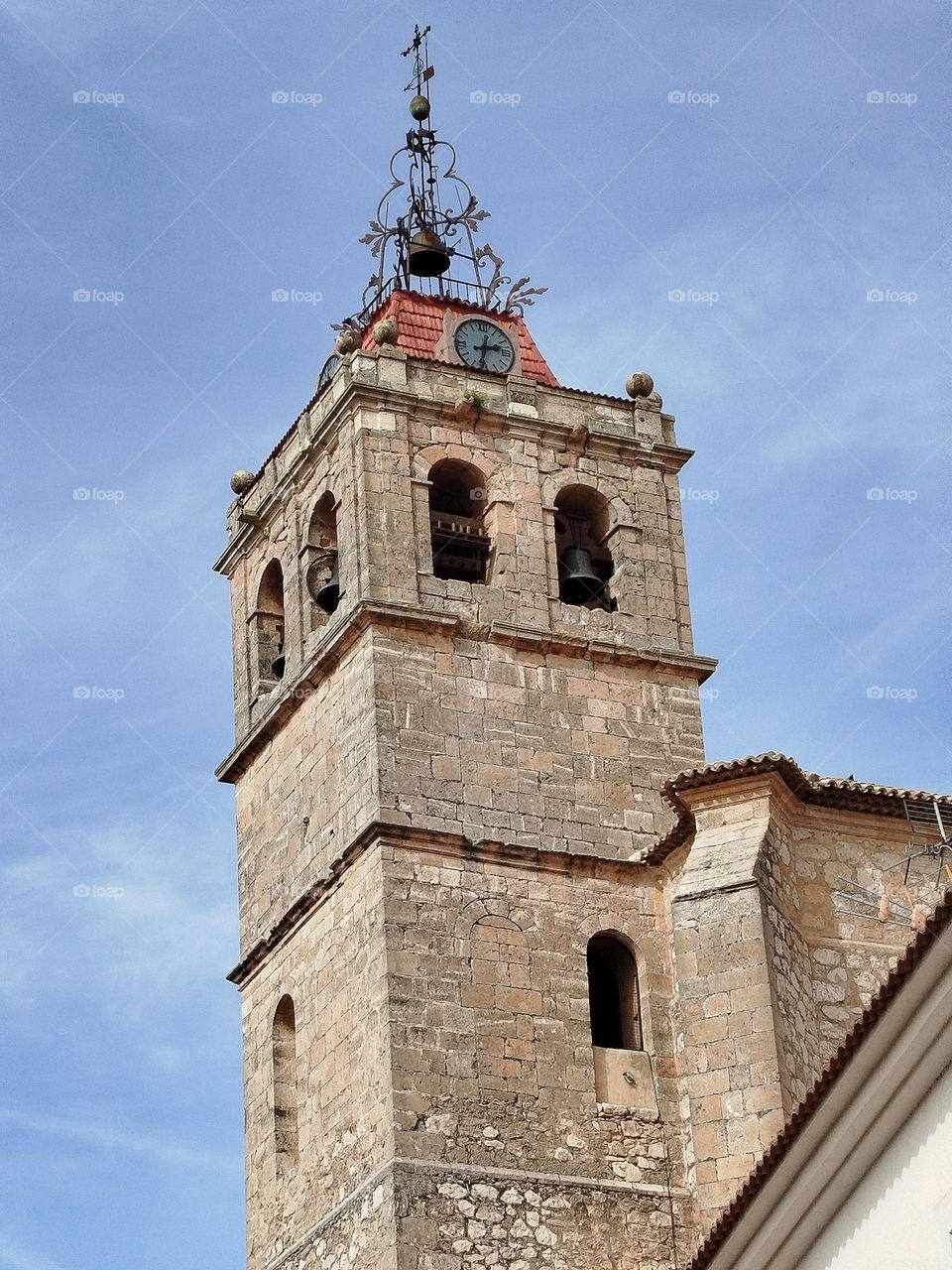 beautiful old bell tower, Immaculate Consecion church, in Horcajo de Santiago. clock
