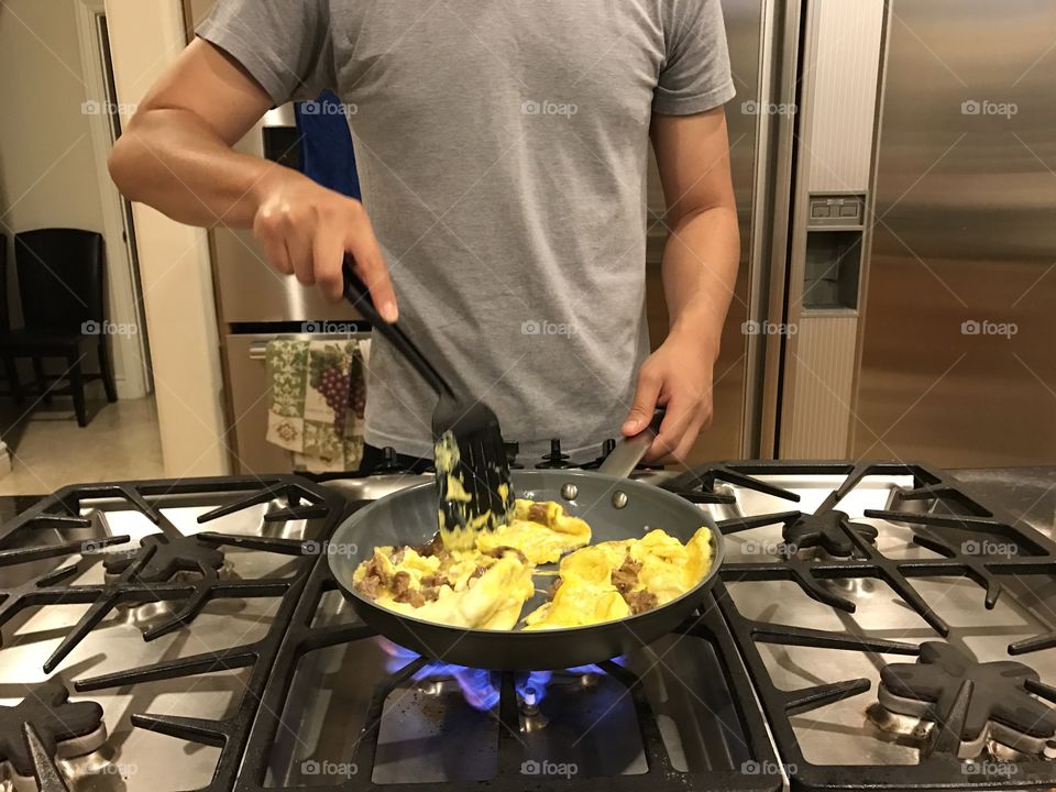 Man cooking with eggs 