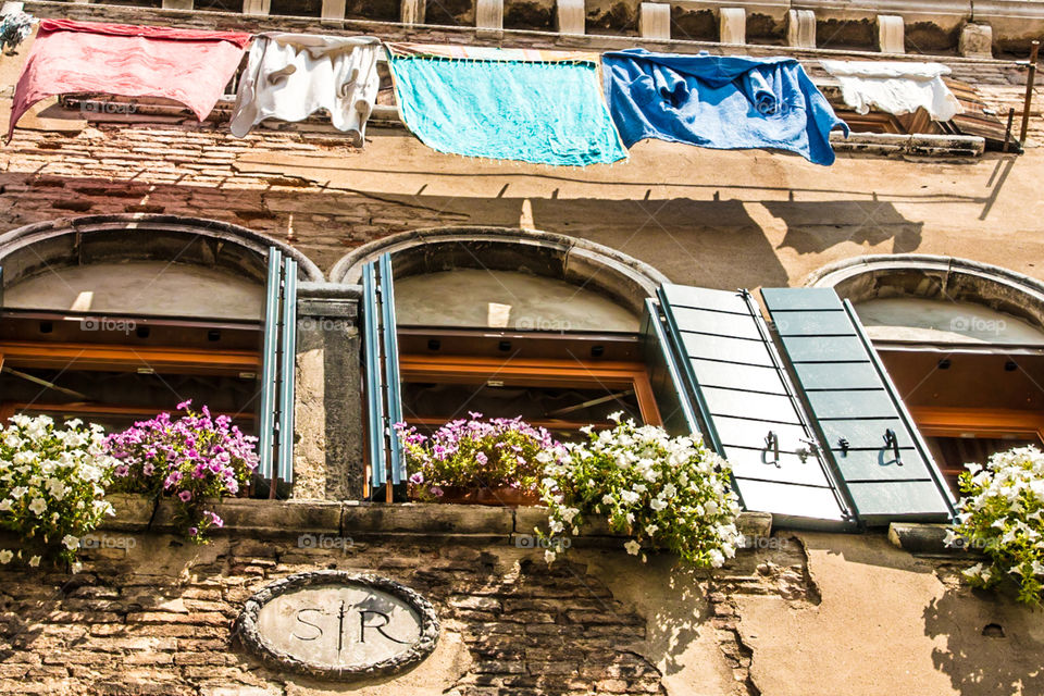 Windows And Hanging Laundry In Venice, Italy