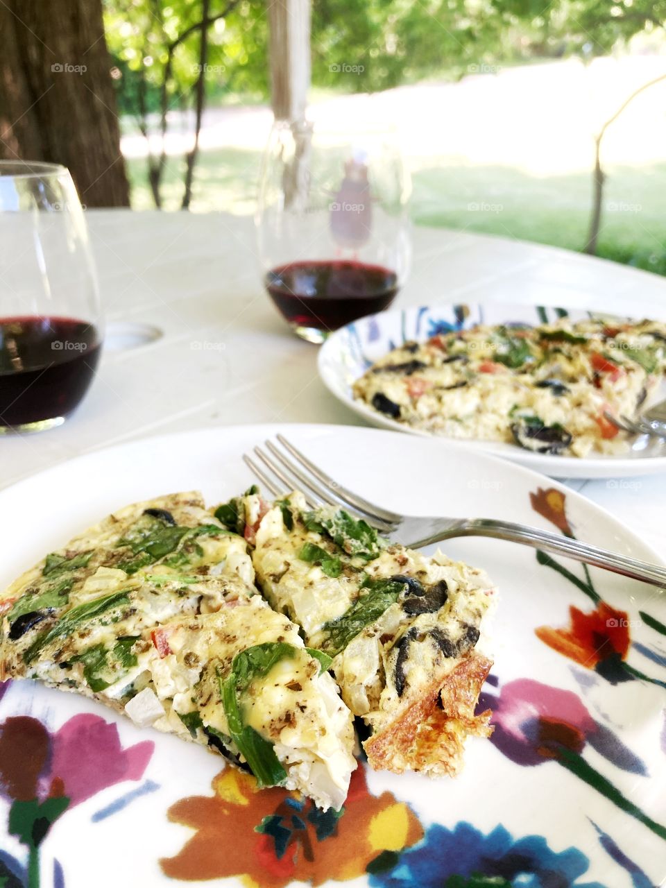 Breakfast frittata with veggies, and a glass of red wine