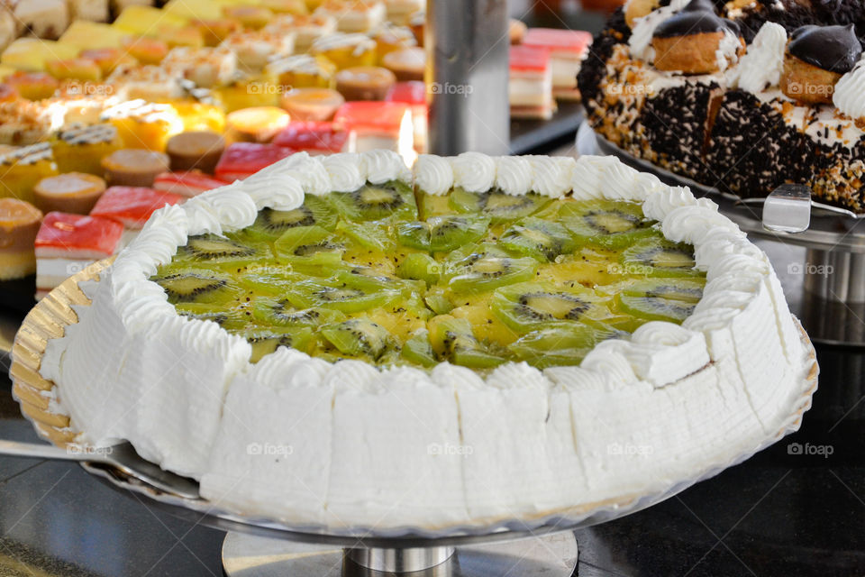 Dessert Cake made of Kiwi on displat on a buffet at a hotel.