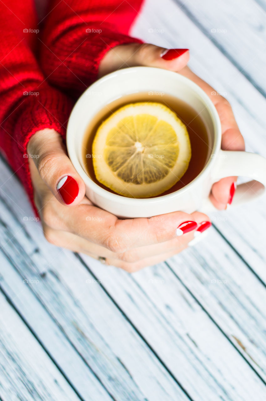 woman hand with cup of tea