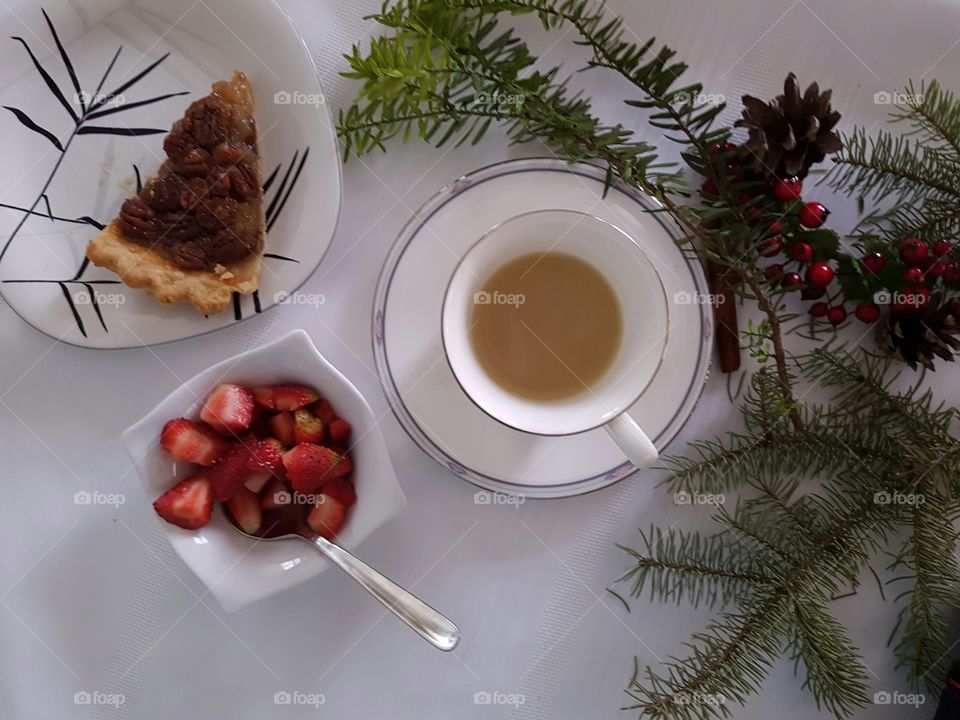 Pecan pie, fresh strawberries and coffee with rustic decor