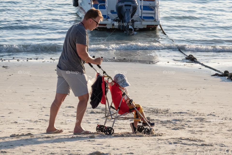 Family happy fun on the beautiful beach