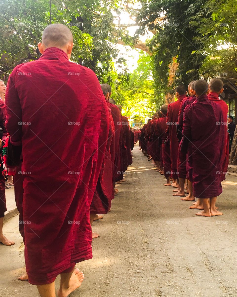 Monks line up for lunch. Mandalay, Myanmar. 