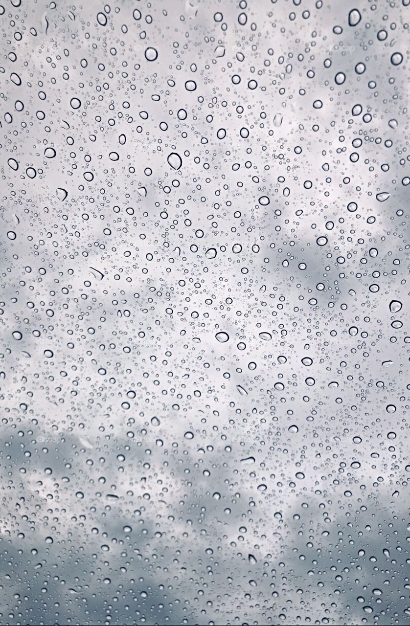 Rainy day. Raindrops on the window on a cool fall afternoon in the USA, America. 