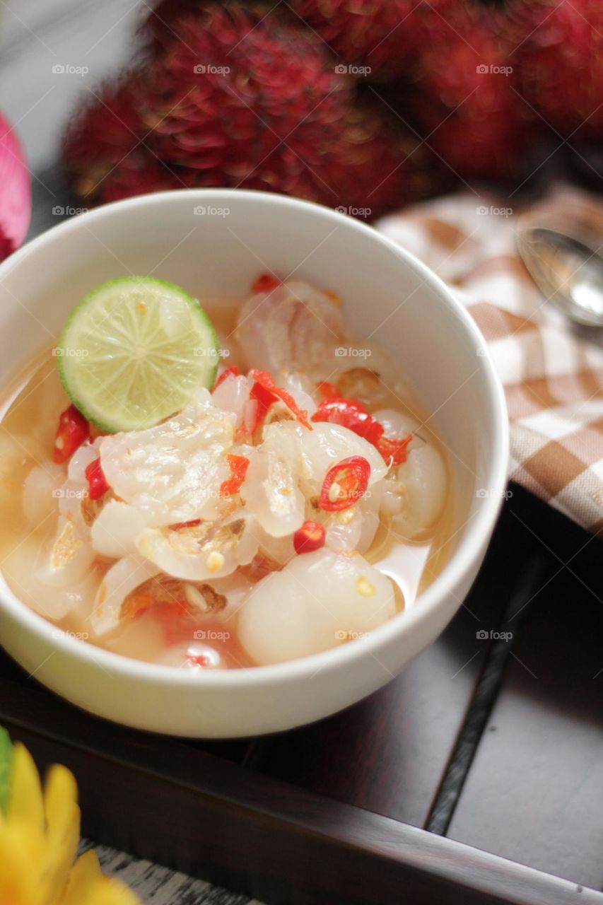 Asinan Rambutan - commonly found in Indonesia. Is a savory snack where the rambutan fruit goes through a pickling process, soaking it in a zesty mixture of salt, sugar, kiamboy, chilli and lime
