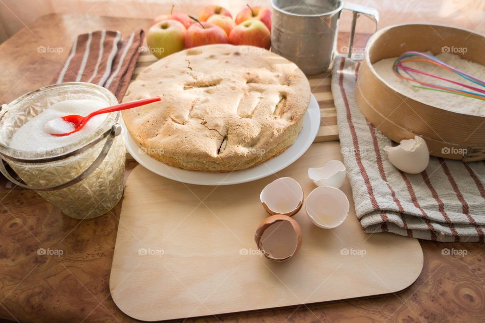 Making homemade puffed apple pie with eggs, sugar and flour.