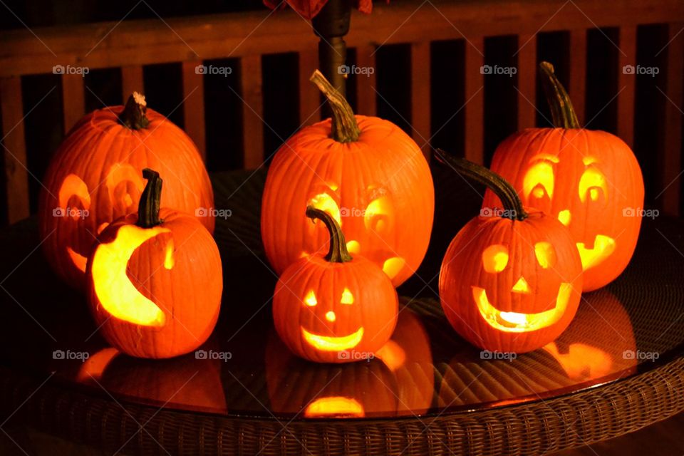 Illuminated Jack o lanterns on table