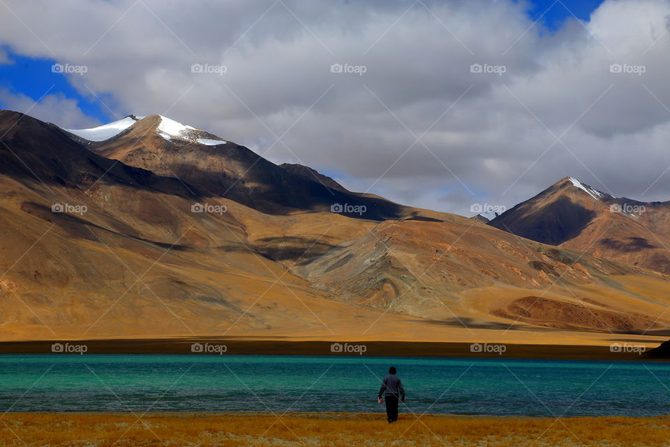 Pangong Tso, Tibetan for "high grassland lake", also referred to as Pangong Lake, is an endorheic lake in the Himalayas situated at a height of about 4,350 m. It is 134 km long and extends from India to the Tibetan Autonomous Region, China