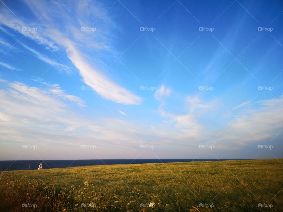 Blue sky with some clouds on Cape Tyron, Prince-Edward Island, Canada