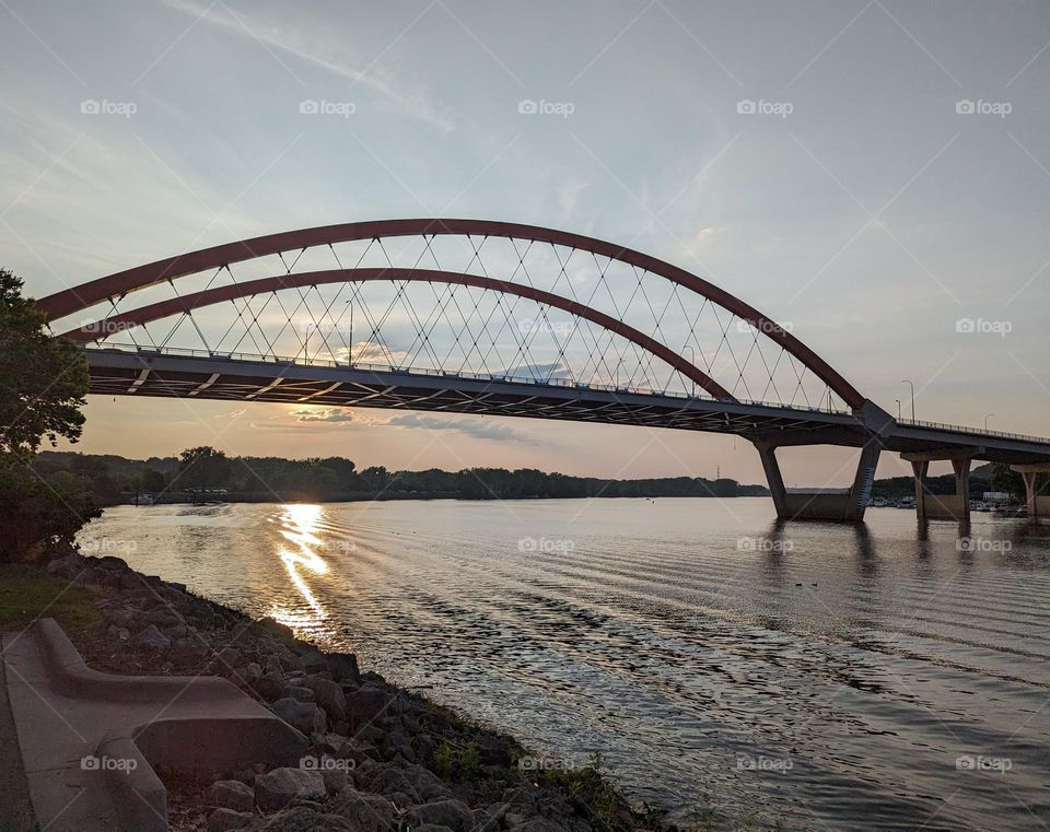 beautiful architectural bridge with a rippling river underneath at sunset, arched bridge, bridge architecture, river bridge
