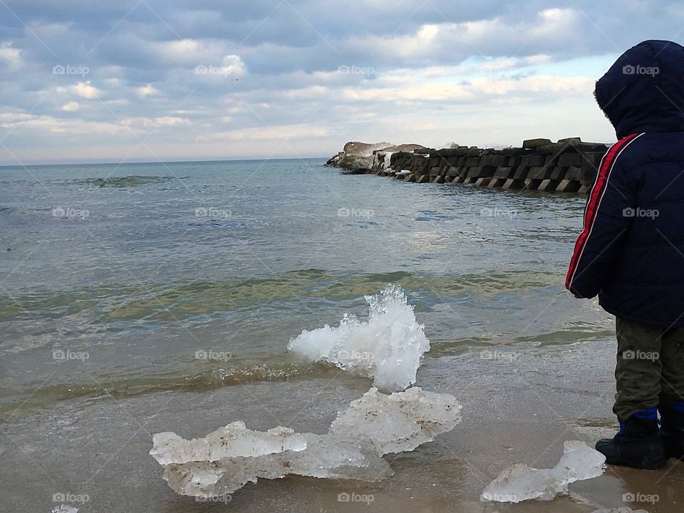 Playing on the icy shore of Lake Michigan 