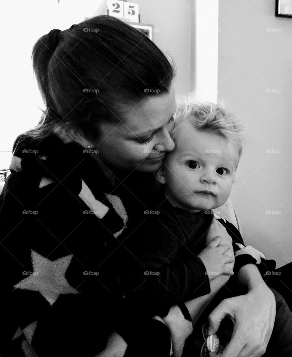 Mother and son cuddling. 
