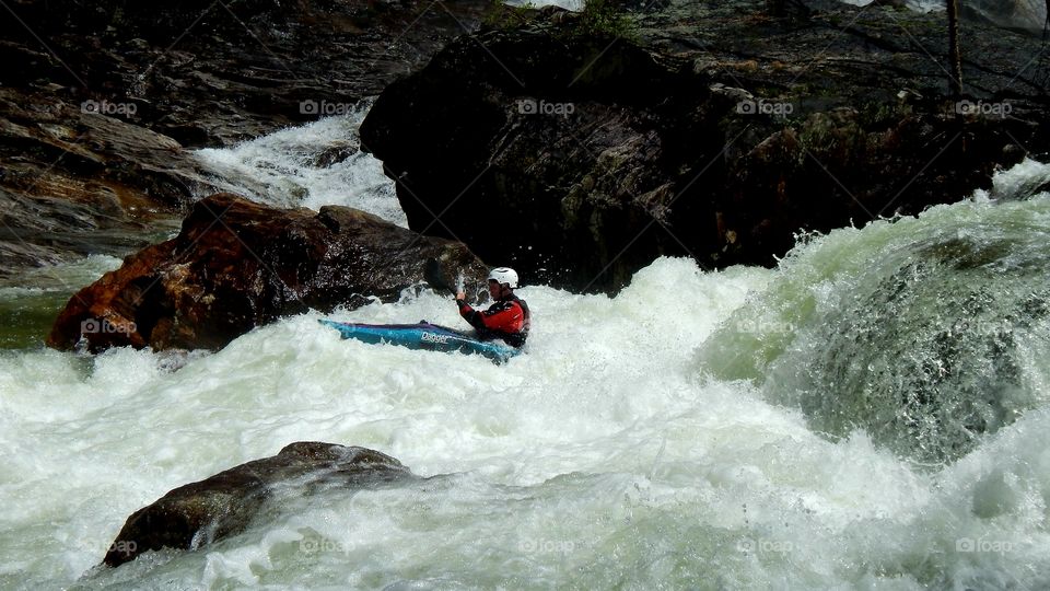 kayaker battling the whitewater during the High falls whitewater release in North Carolina
