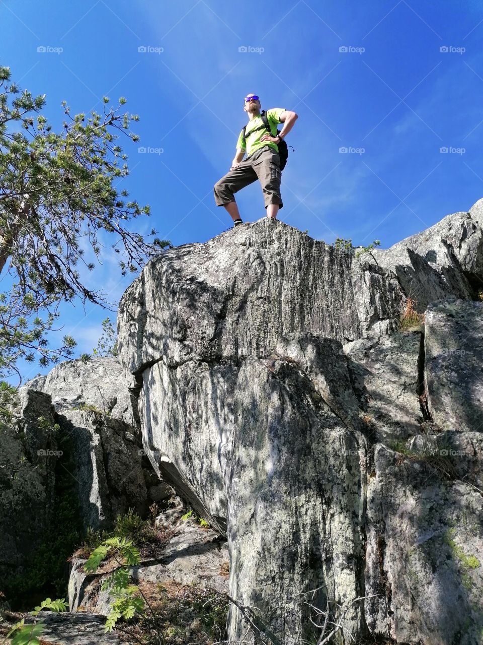 A man hiking in Lapland, Finland in summer. There are great views from the top of the mountain!