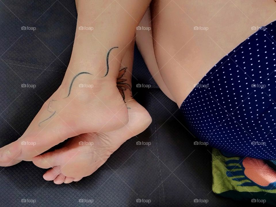 It looks very attractive to have tattoos on your feet and calves... A kitten or a fairy are good options! Bare feet, healthy lifestyle.