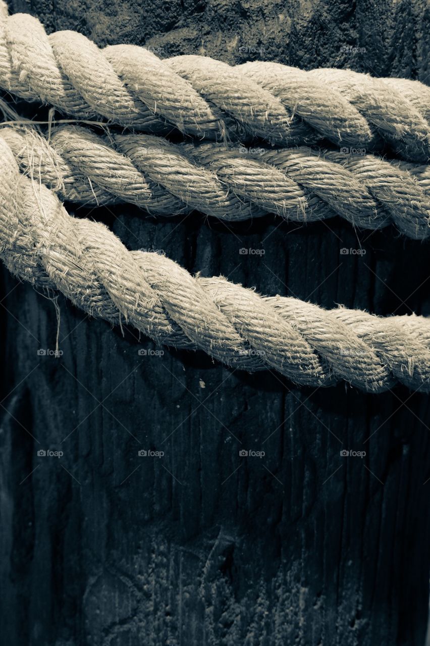 Monochromatic Rope Wrapped Around A Wooden Pier 