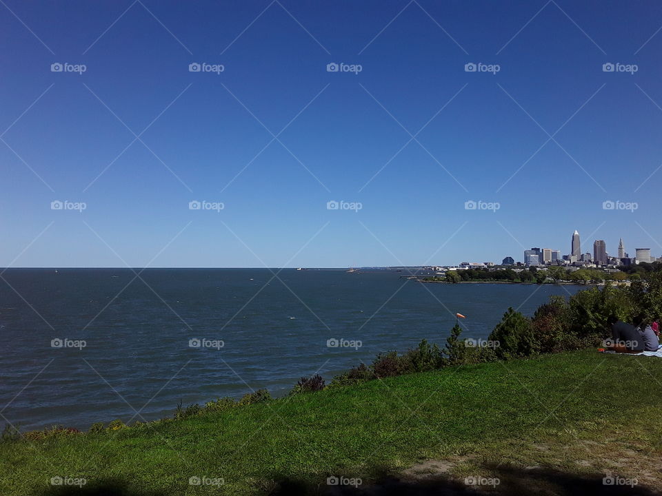 sky and lake Erie with the green grass