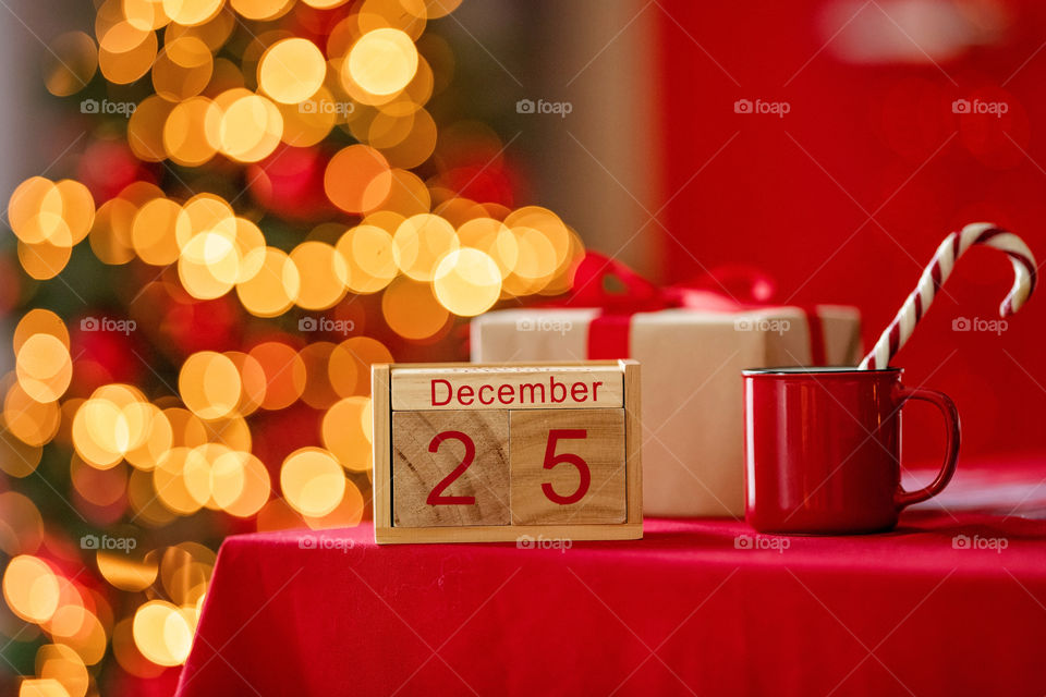 Christmas background with wooden block calendar with the date of December 25