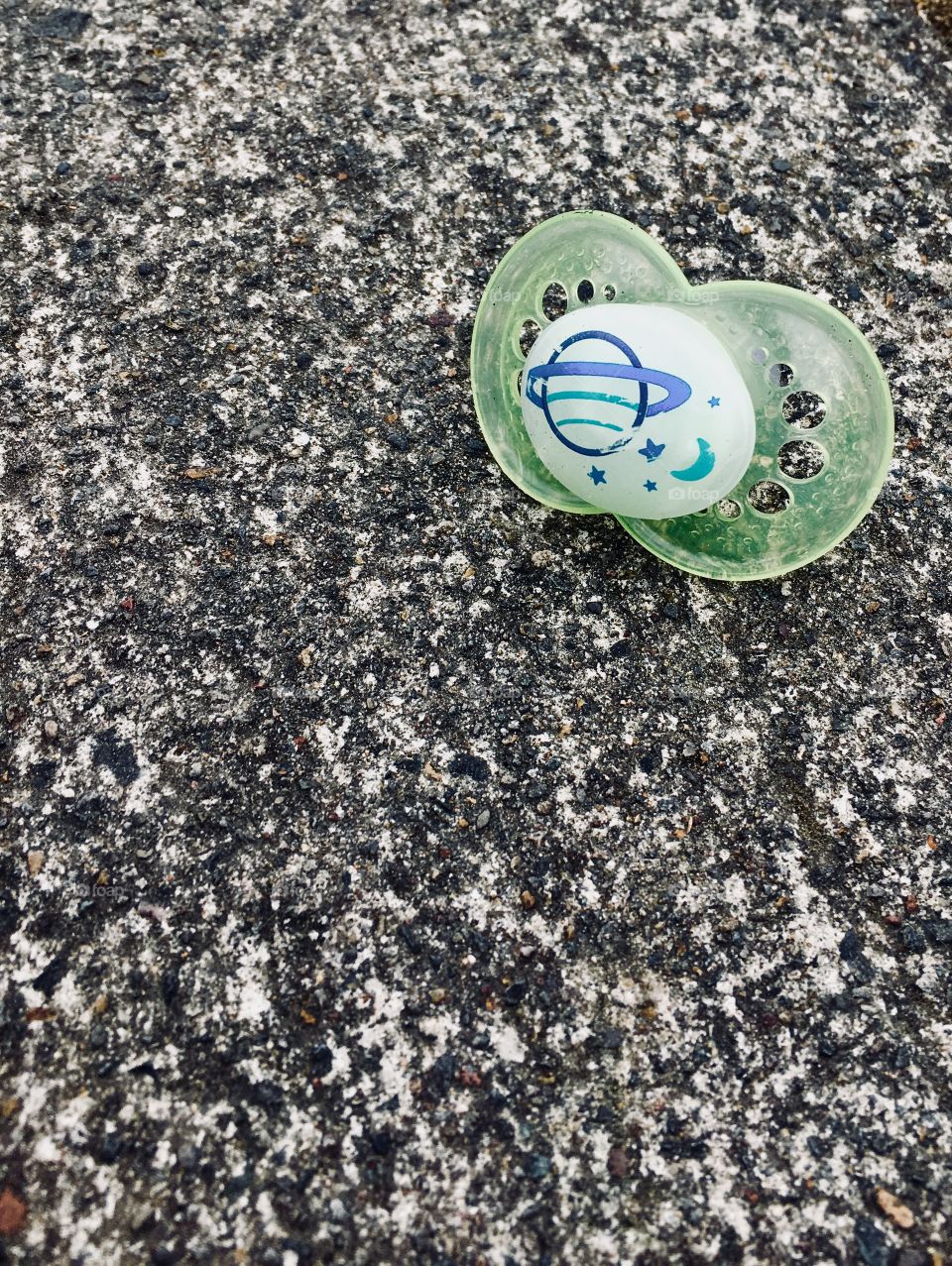 Pacifier on asphalt
