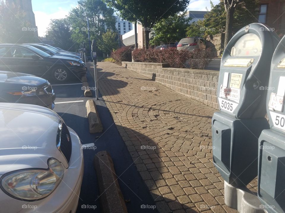 cars at a parking meter