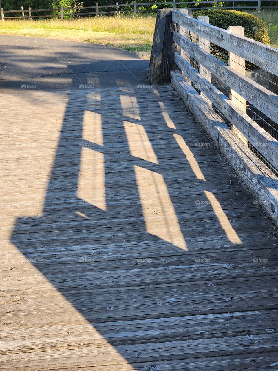 house shaped bridge railing shadow