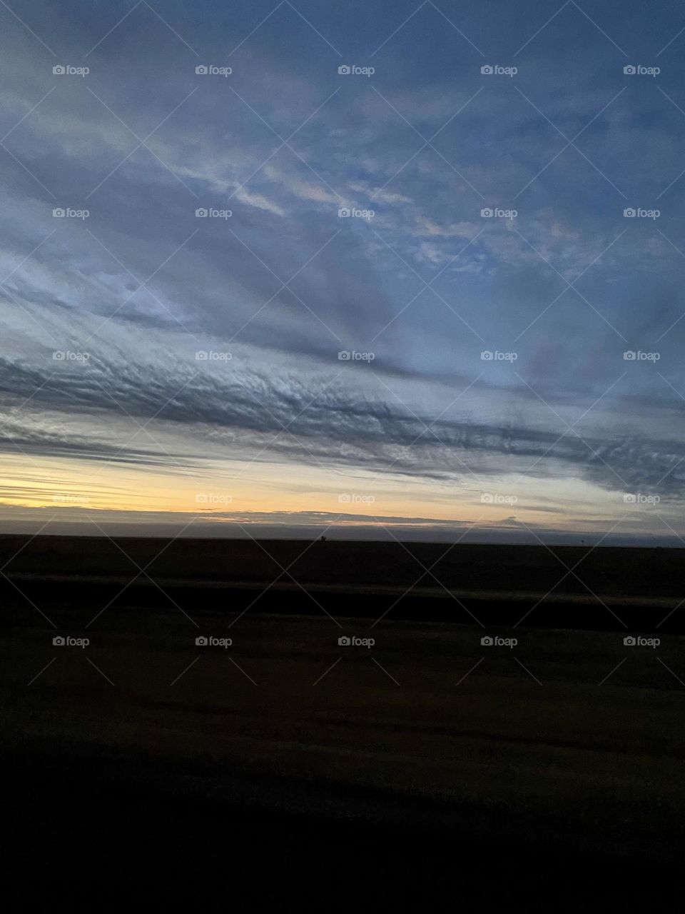 Sunrise driving on Interstate 40 highway through Conway Texas